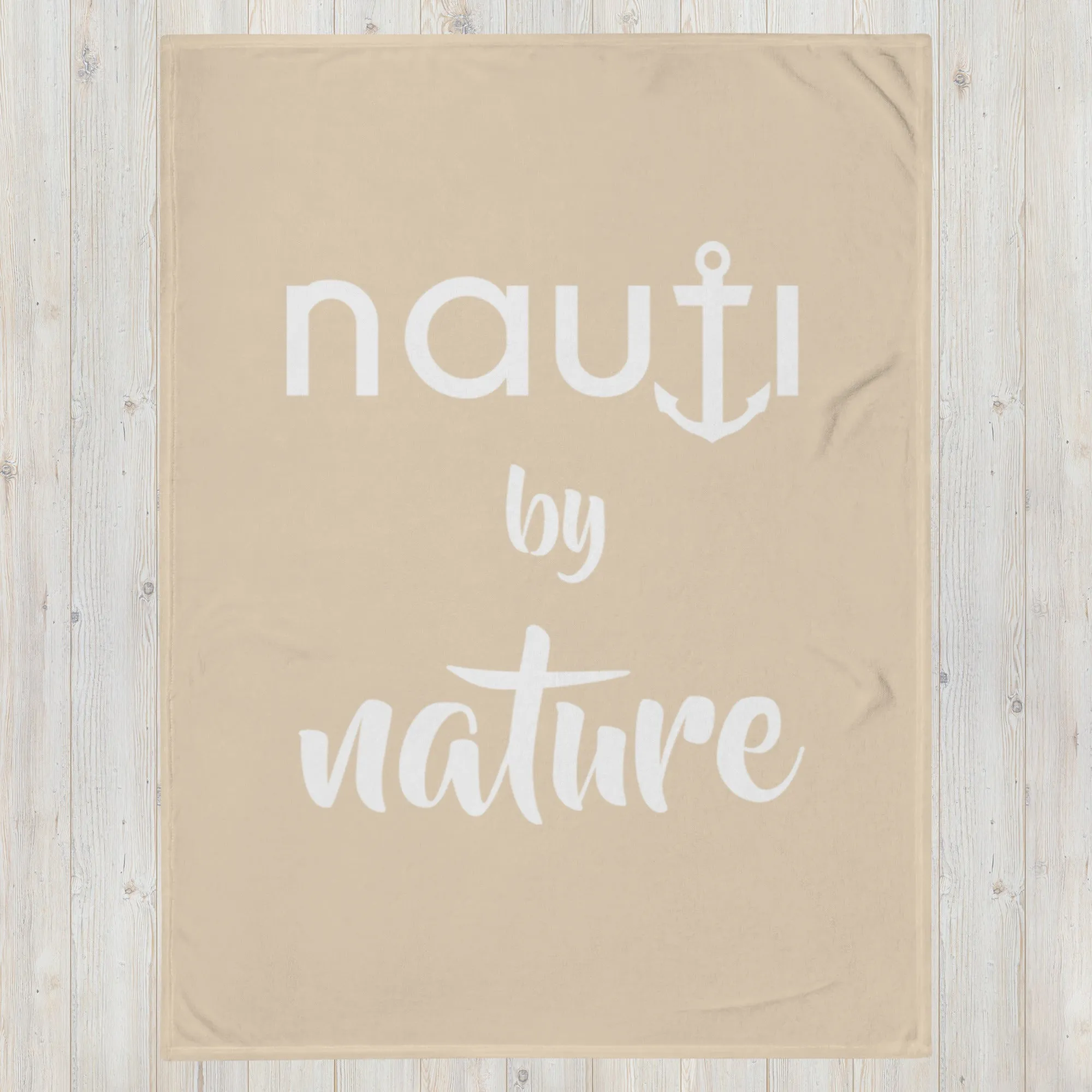 "NAUTI BY NATURE" blanket in champagne with white logo