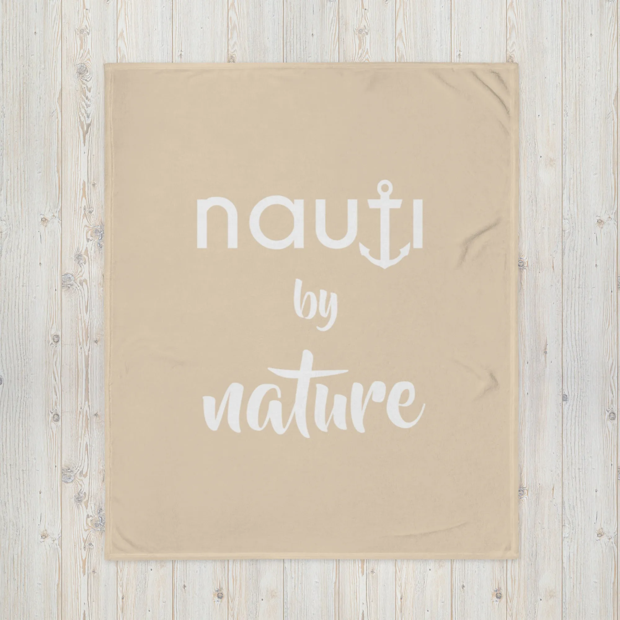 "NAUTI BY NATURE" blanket in champagne with white logo